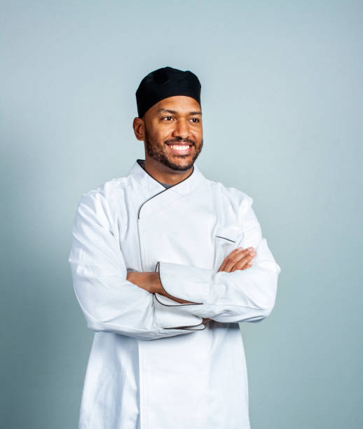 istock Confident chef standing with arms crossed 1300835455