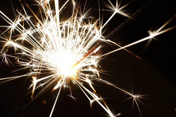 istock Bright sparks in total darkness. Closeup. 1300836667