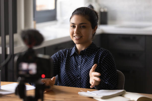 istock Indian woman coach record video tutorial at home 1300836700
