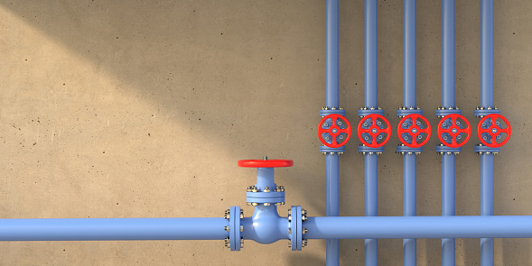 Drink water treatment plant piping. Industrial metal pipelines blue color and valves with red wheels on concrete wall background, banner. 3d illustration