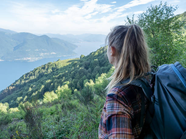 istock Hiker female contemplates view from mountain top 1300837353