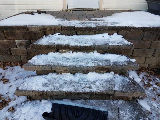 istock cement steps or stairs with snow and snow shovel 1300838527