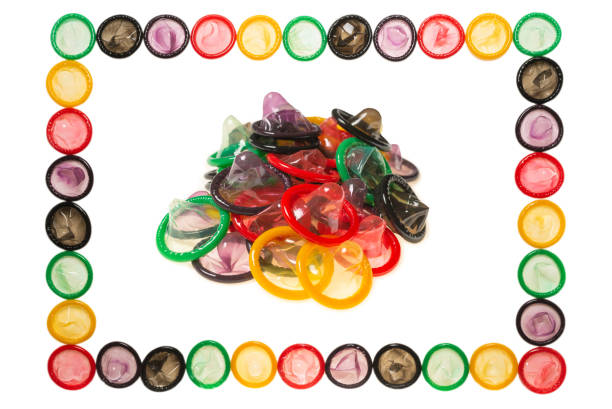 istock Colorful condoms background. 1300839553