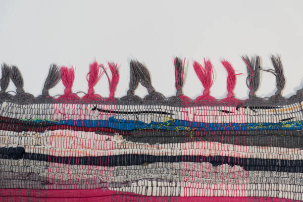 istock A rug made of multicolored strips of fabric. Handwork. Close-up, background and texture 1300840128