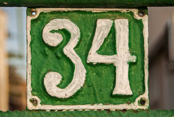 istock Old retro cast iron plate number 34 1300841665