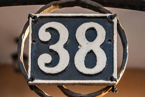 istock Old retro cast iron plate number 38 1300841703