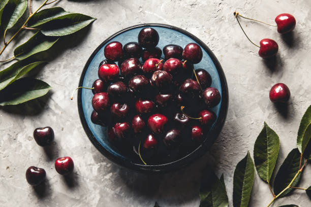 istock Sweet organic berries on a light concrete background. Top view with copy space. 1300842649