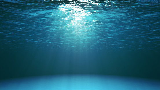 Superficie del océano azul oscuro vista desde el agua photo