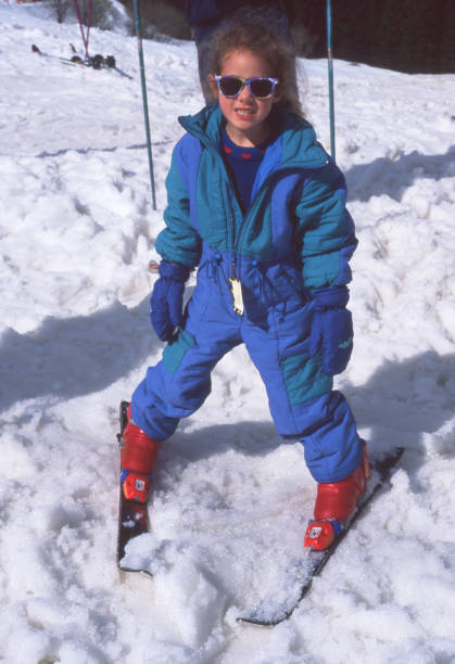 istock A child smiling face on skis 1300845233
