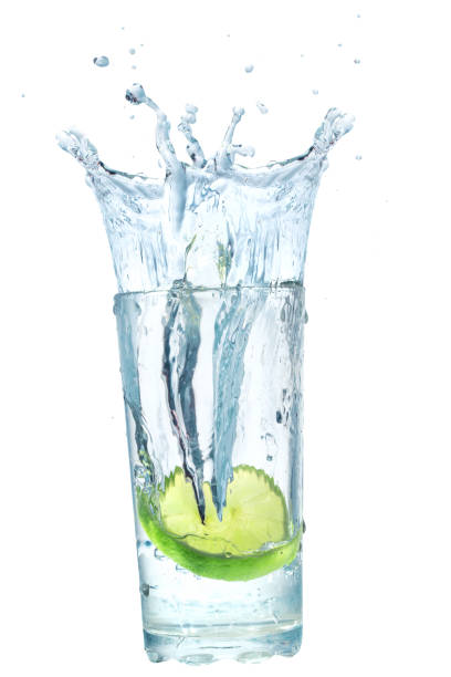 istock lemon fell in a glass with water isolated on white 1300846928