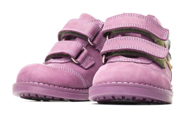 istock magenta children`s boots isolated on white background 1300847624