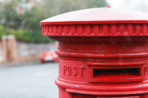 Public Mailbox at Eynsford High Street in Kent, England, after springtime snowfall.