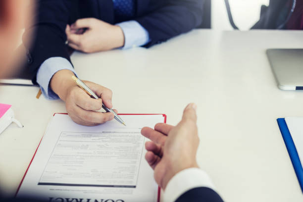 istock Signing the agreement in the contract document. 1300848711