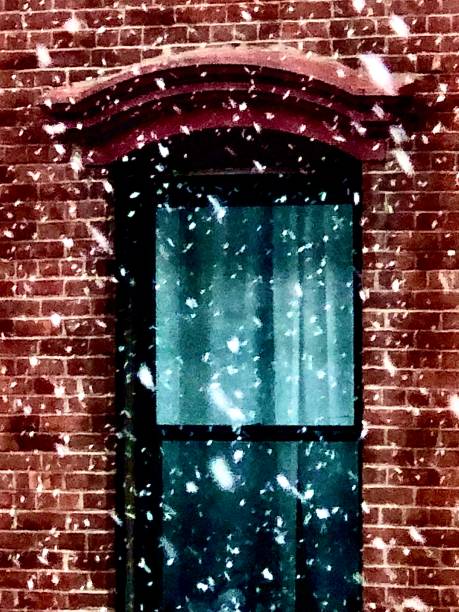 istock Snowflakes And Brick Building 1300850384
