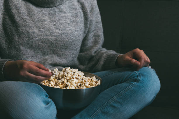 istock Watching TV with a bowl full of popcorn 1300852848