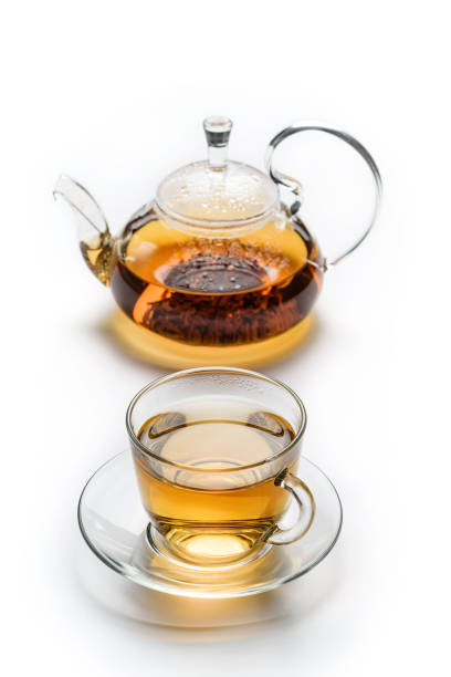 istock Cup with tea and teapot isolated on white background. 1300853109