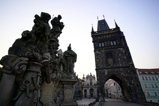 istock Sculptures and Tower of Charles Bridge, Prague, Old Town Side 1300853225