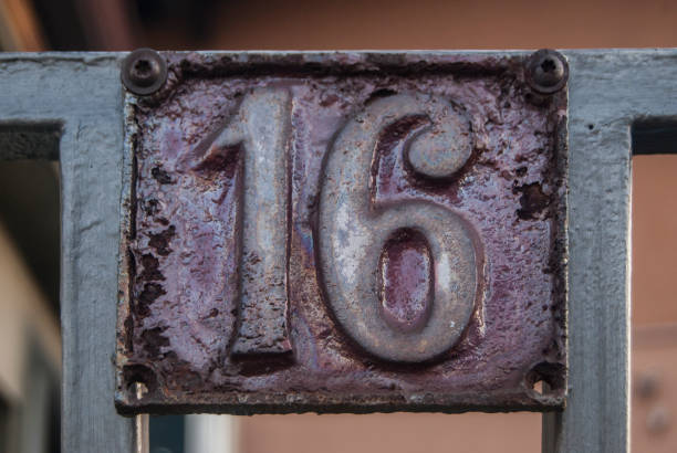 istock Old retro cast iron plate number 16 1300853399