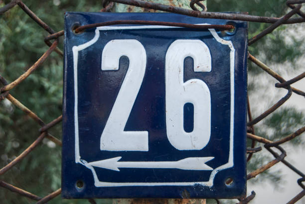 istock Weathered enameled plate number 26 1300853408