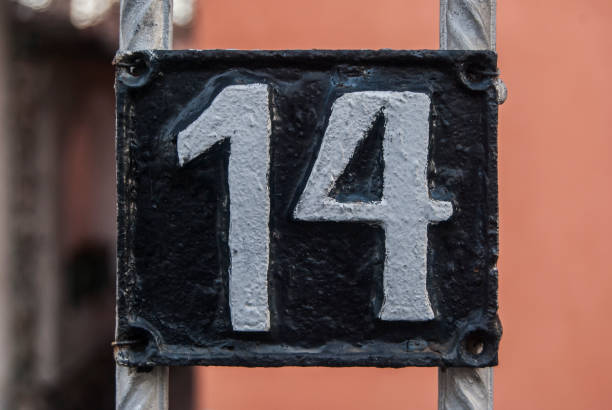 istock Old retro cast iron plate number 14 1300853412