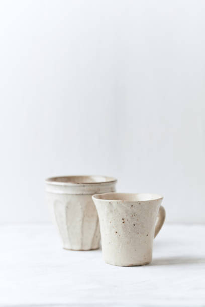 istock Tea culture. Traditional, handcrafted ceramic on bright wooden background. Copy space. 1300857039