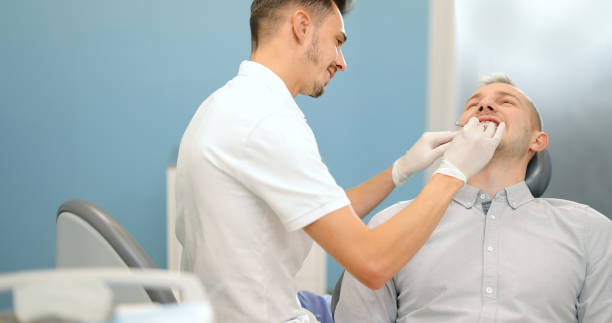 istock Patient and dentist during a dental check up 1300857195