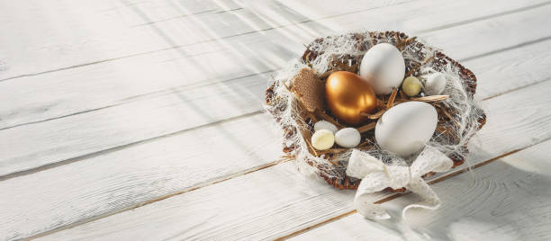 istock Easter zero waste, environmentally friendly gift wrapping kraft paper, eggs in a basket, gift basket, cozy religious Easter holiday, eco concept eco friendly decor banner on gray background 1300857303