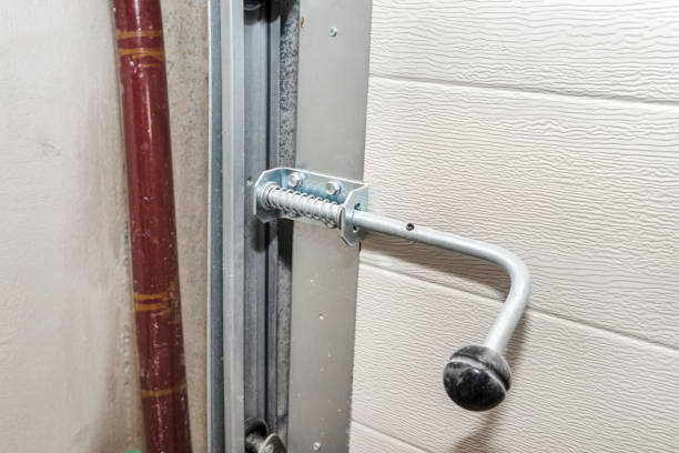 istock Manual spring latch from the home garage door, visible guides from the gate. 1300858443