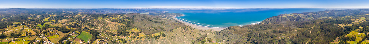 Puertecillo Beach close to Santiago de Chile an amazing place for surf and enjoy at the beach on an amazing wild landscape with the Pacific Ocean and the cliffs surrounding the beach making it an idyllic destination to be in heaven, Chile