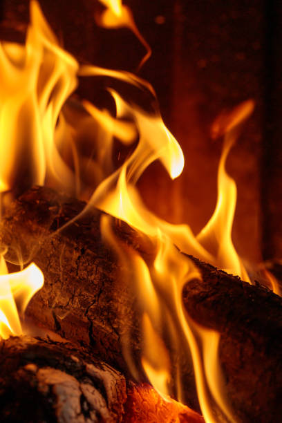 istock flames consuming log burning in the fireplace 1300859856