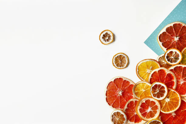 Flat lay composition of orange, lemon and grapefruit slices isolated on white background. Dried citrus slice with seeds. Concept dried citruses.