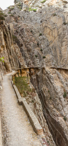 an amazing view of "el caminito del rey" gorge, an awe cliff walk with an amazing scenery in between the rock and the river, an idyllic view - ravine geology danger footpath imagens e fotografias de stock