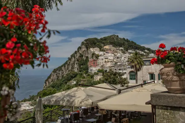 View on villas and colorful houses sited on a steep hill on the island of Capri, Capri town, Tyrrhenian sea, Italy