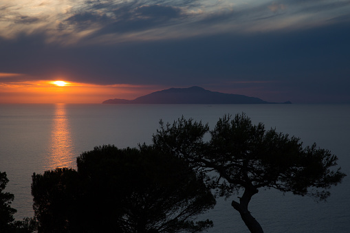 Beautiful sunset on the island of Capri with a view of the island of Ischia, Tyrrhenian sea, Italy