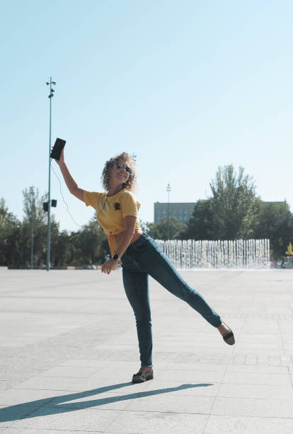 istock Dancing woman on the street 1300864353