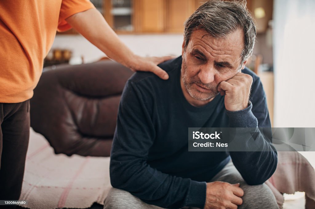 Support for a depressed person Alcohol Abuse Stock Photo