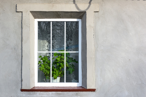 Plastic window in an old renovated house