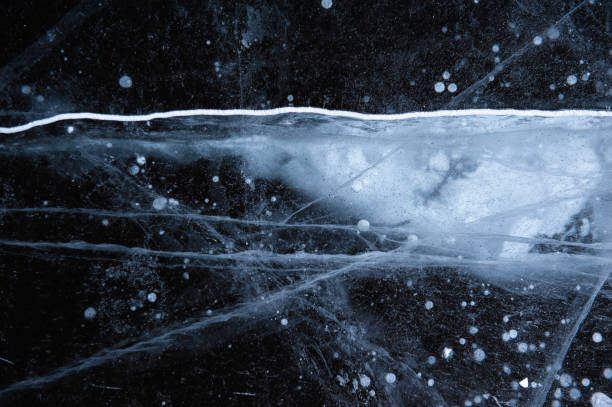 istock Ice texture with scratches and frozen bubbles. Winer abstract background 1300864668