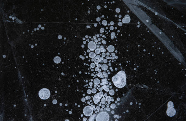 istock Ice texture with scratches and frozen bubbles. Winer abstract background 1300865278
