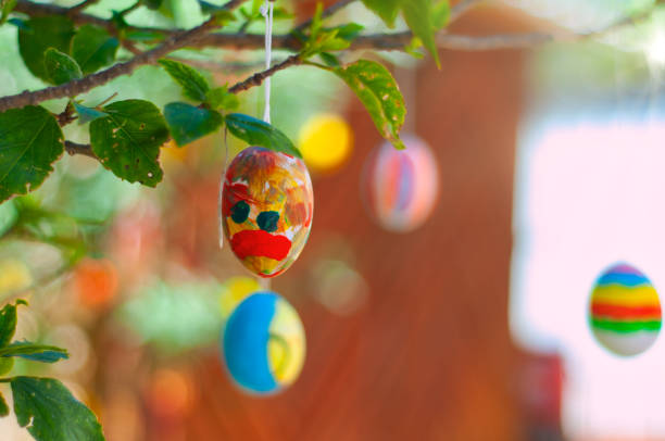 istock Colorful Easter eggs hanging on branches of a tree 1300868347