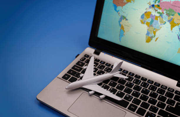 istock Toy plane on the notebook with world map. 1300870495