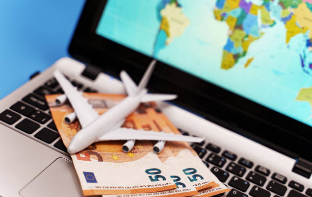 istock Toy plane on the notebook with world map. 1300870519