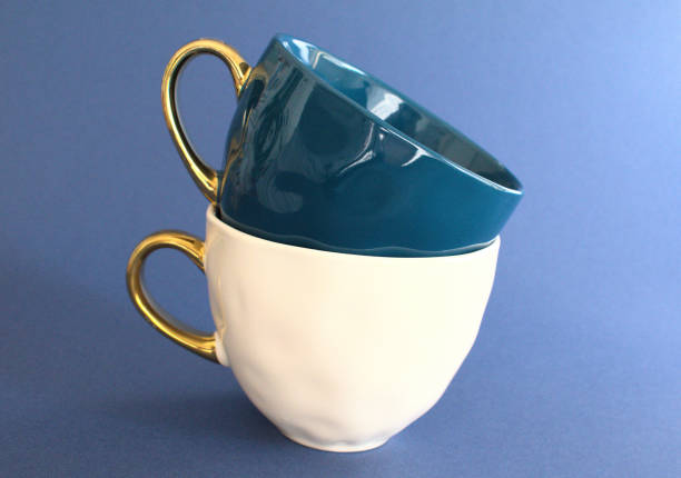 istock White and navy blue elegant cups for tea. Creative dishes composition. 1300870840