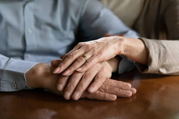 istock Close up mature spouses holding hands, enjoying tender moment 1300870984