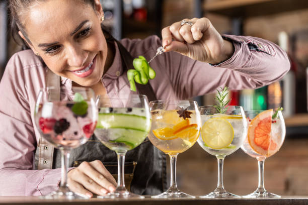 istock Bartender makes summer refreshing gin tonic cocktails on a bar. 1300870997