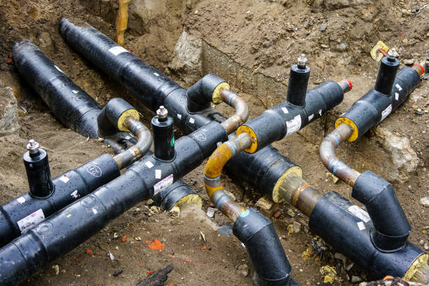 istock underground heating system pipes replacement on the city street 1300871913