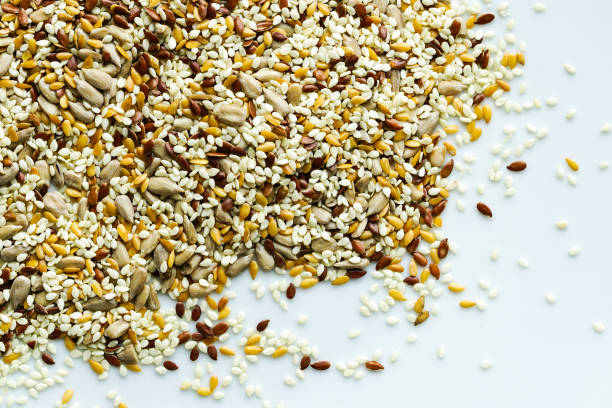 istock a mixture of different seeds on a white background 1300871973