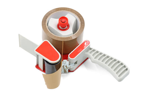 istock Brown adhesive packaging tape dispenser isolated on a white background 1300873666