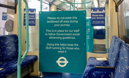 London, United Kingdom - August 29, 2020: Safety notice prompting passengers not to enter dedicated area and practise social distancing travelling on public transport train during covid-19 outbreak