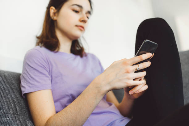 istock Young unrecognizable woman spending time on her phone 1300876229